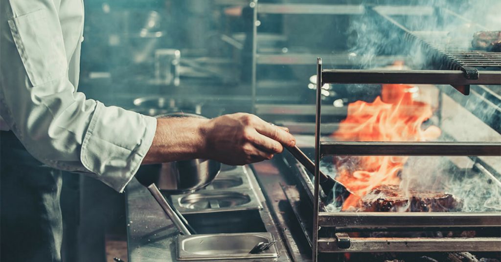chef working in the heat in a kitchen