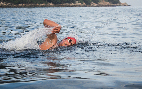 swimmer with red cap