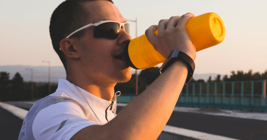 man drinking energy drink