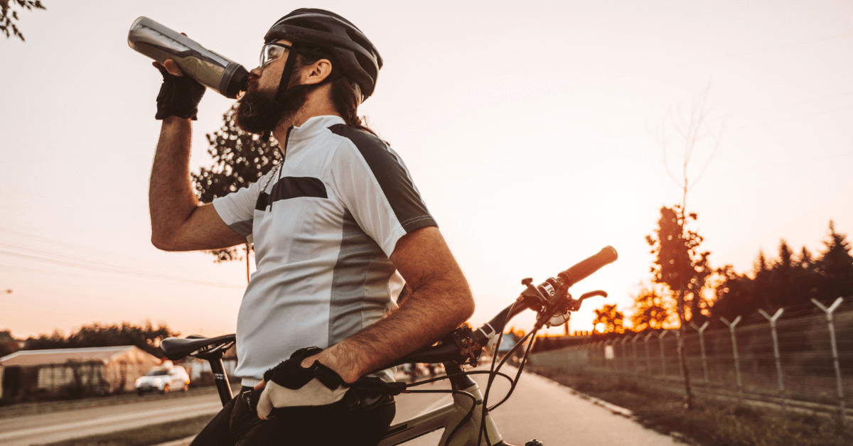 cyclist drinking energy drink